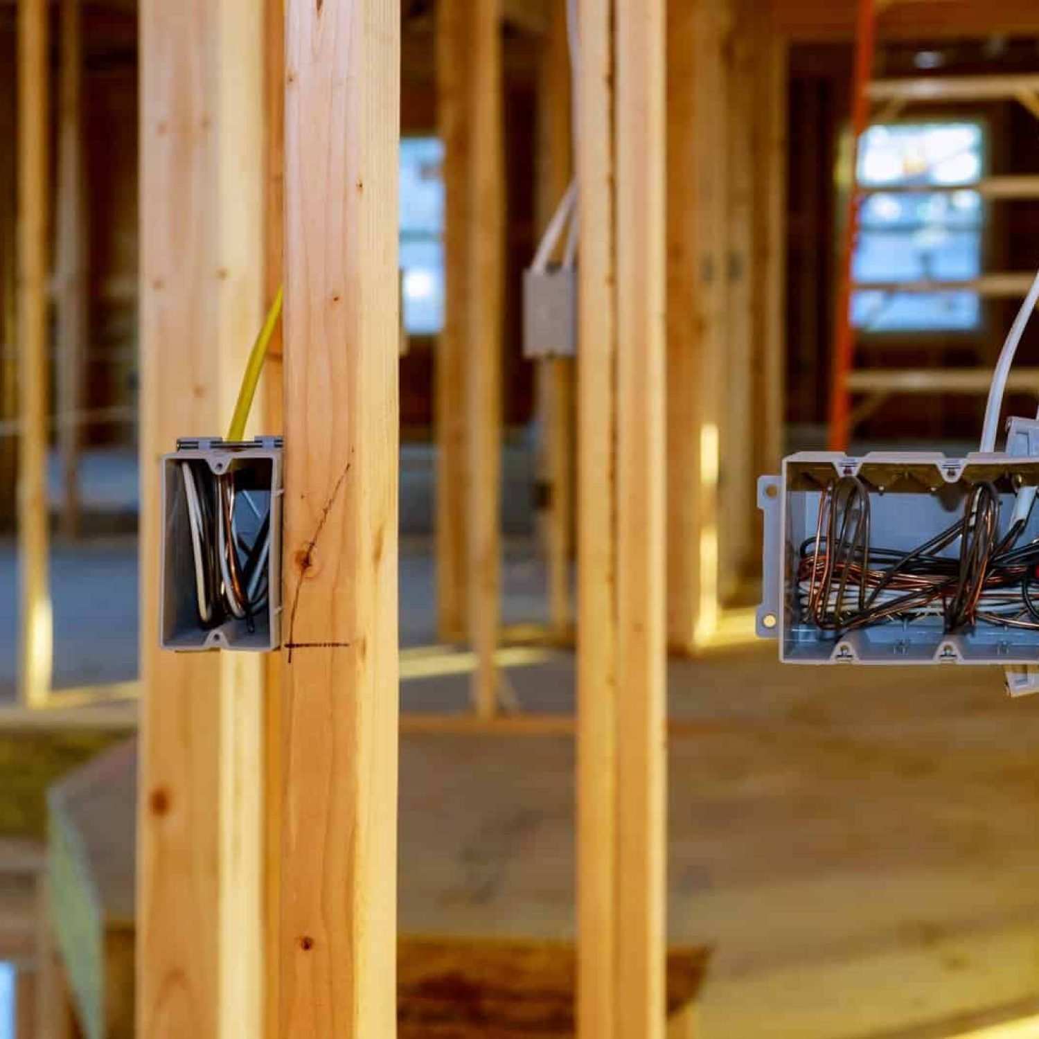 Electrical wiring installation in a new home construction site.